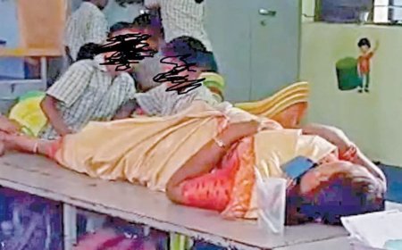 தலைமை ஆசிரியருக்கு மசாஜ் செய்த மாணவர்கள்; தலைமை ஆசிரியை பணியிட மாற்றம்